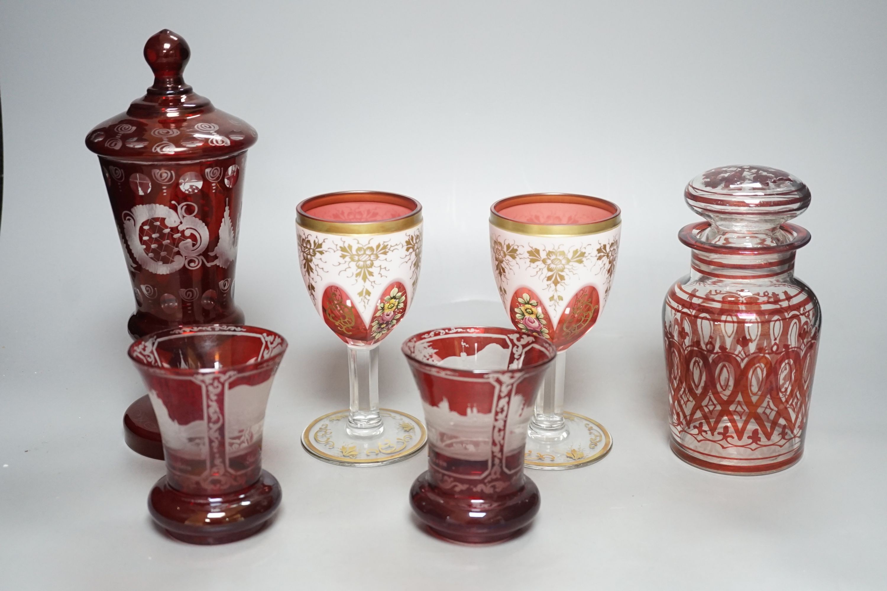 A pair of 19th century Bohemian ruby overlaid wine glasses, possibly Moser and other bohemian ruby glasswares